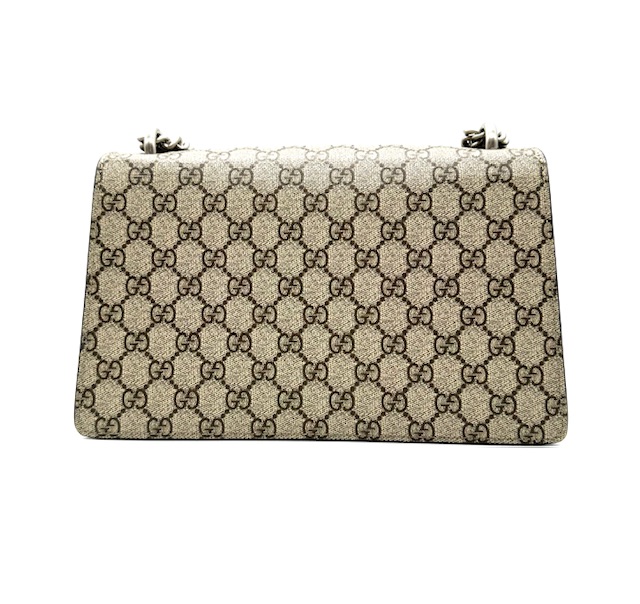 Bolso Dyonisus beige con estampado monogram y detalles de ante negro.