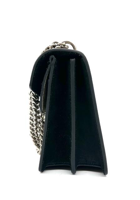 Bolso Dyonisus beige con estampado monogram y detalles de ante negro.