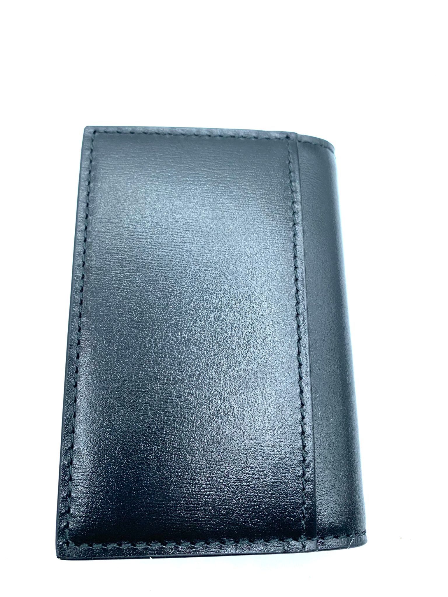 cartera gucci cuero negro sin uso