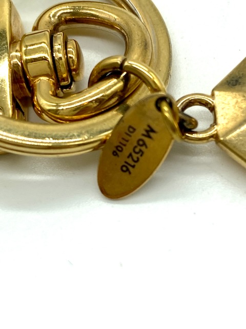 Charm dorado para bolso Louis Vuitton