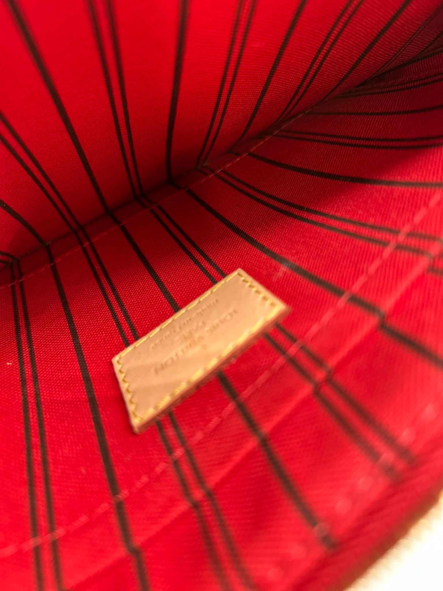 Pochette Louis Vuitton en lona Monogram