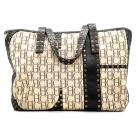 Bolso Carolina Herrera, combinado en cuero marron y tejido icónico de Carolina Herrera.