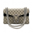 Bolso Dyonisus beige con estampado monogram y detalles de ante negro.