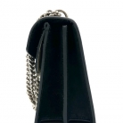 Bolso Dyonisus beige con estampado monogram y detalles de ante negro.