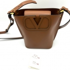 Valentino Garavani Small Bucket Crossbody Bag in Beige