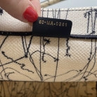 Book tote Dior con libro zodiacale