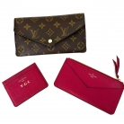 Louis Vuitton monogram canvas wallet with pink interior