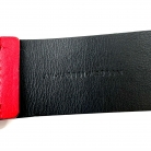 Cinturón Philipp Plein de piel rojo con estrellas. Hebilla plateada.