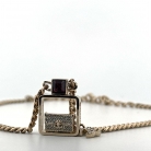 ciondolo Chanel in metallo dorato