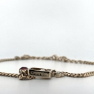 ciondolo Chanel in metallo dorato