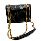 Kate Saint Laurent in pelle di serpente