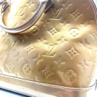 Louis Vuitton Alma PM Vernis dorado