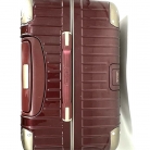 Valigia Rimowa in policarbonato bordeaux con biglietto elettronico