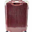 Valigia Rimowa in policarbonato bordeaux con biglietto elettronico