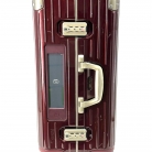 Valigia Rimowa in policarbonato bordeaux con biglietto elettronico