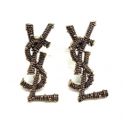 ORECCHINI YSL IN METALLO DORATO