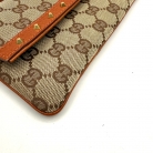 Pochette Gucci en lona GG Supreme
