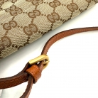Pochette Gucci en lona GG Supreme