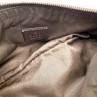 Pochette Gucci en lona GG Supreme