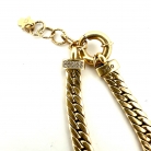 Bracciale a maglie gourmette in oro con dettagli di diamanti