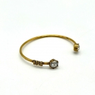 Bracciale Dior in metallo dorato con design aperto