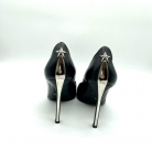 Tacones Dior con adorno estrella en plateado