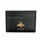 Portacarte Gucci in pelle nera con dettagli oro